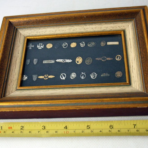 Frame with 27 old German Nazi military badges from World War II like new