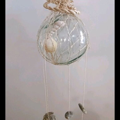 Melodos with seashells decorative used, glass base