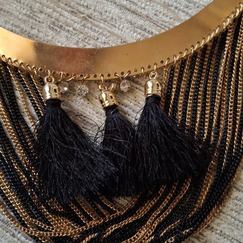 Gold necklace like new with black and gold chains and tassels