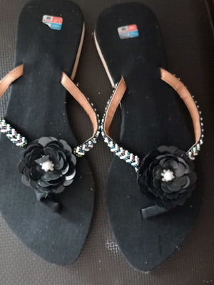 Women's slippers used, black with decorative flower, size 38