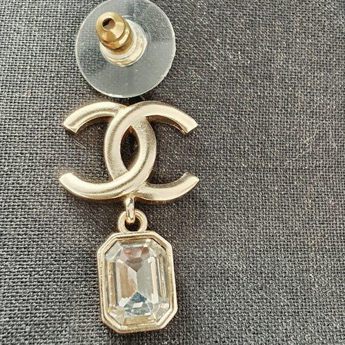 Chanel earrings with white and gold details