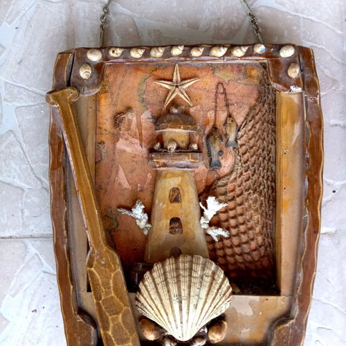 Wooden handmade lighthouse frame with real coral, starfish, shell