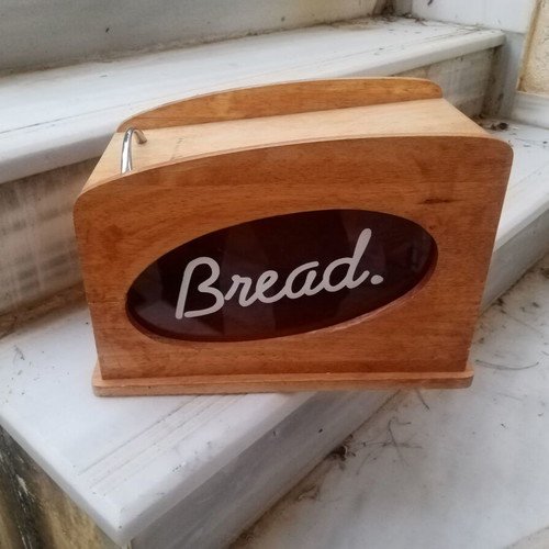 Wooden breadbox with hinged lid and metal handle used