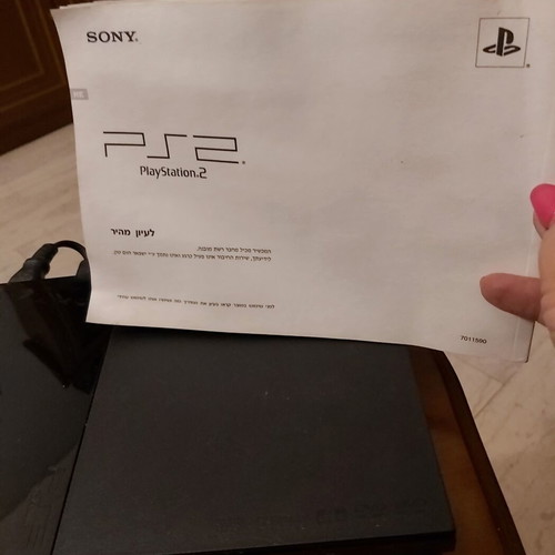 Sony PlayStation 2 console used with remote and 10 games