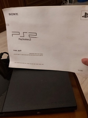 Sony PlayStation 2 console used with remote and 10 games