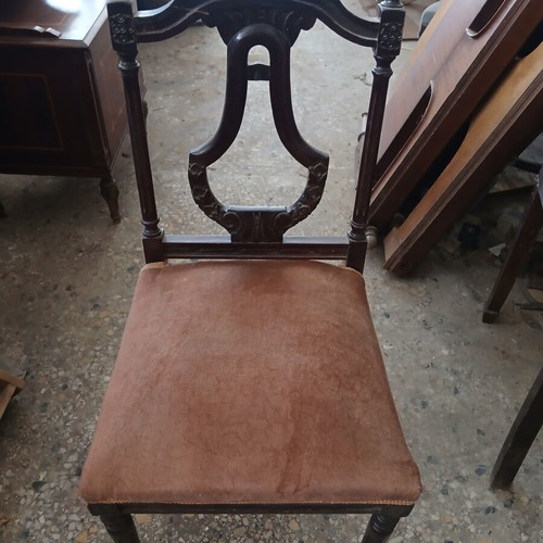 Vintage wooden chair used with brown velvet upholstery