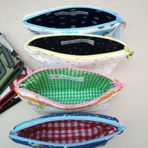 Set of 7 toiletry bags and 1 black satin pouch new, multicolored