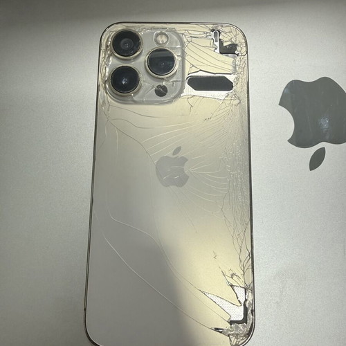 Apple iPhone 13 Pro 256GB gold with cracked back and case