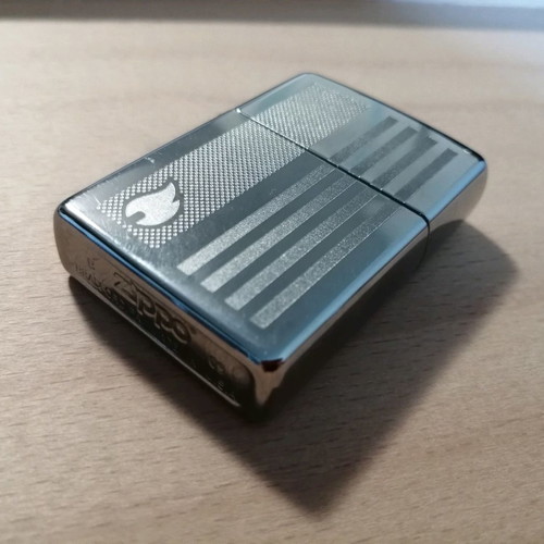 Zippo lighter used with engraved decorative design