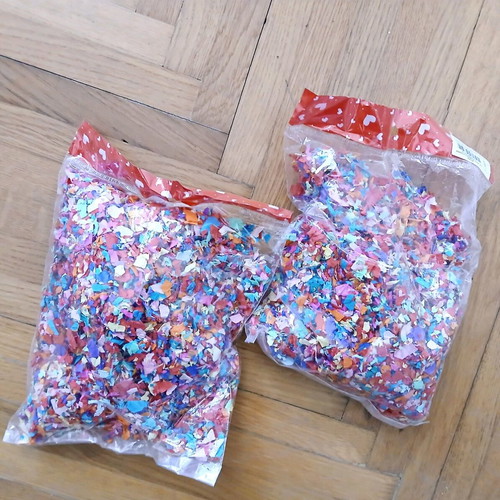 Two bags of confetti new, colorful paper pulp