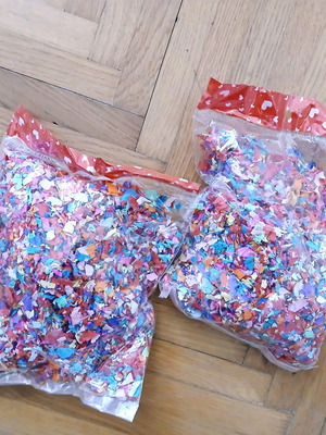 Two bags of confetti new, colorful paper pulp