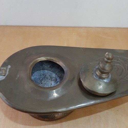 Copper oil lamp used with carved decorations and patina