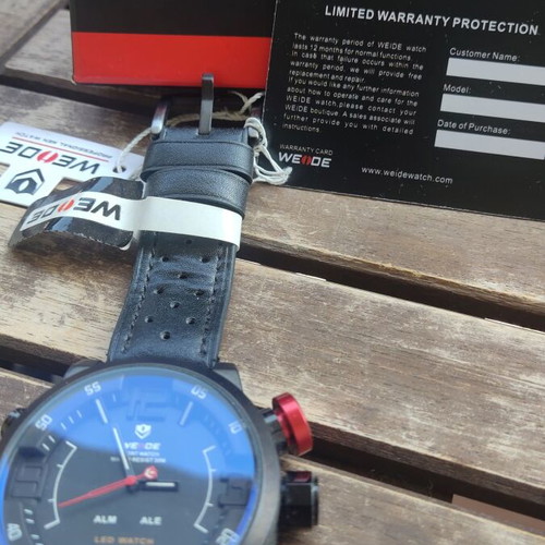 Weide wristwatch new, black leather strap