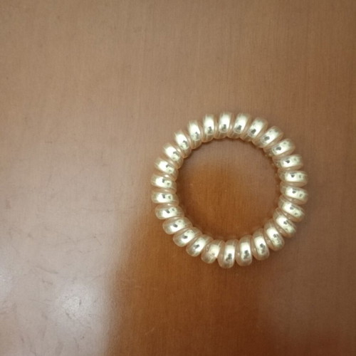 Spiral Hair Tie like new, shiny gold color