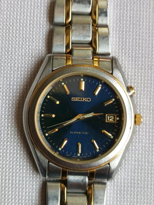 Seiko kinetic bicolor watch like new with date display and luminous dial