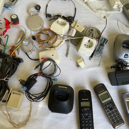 Set of old cables, sockets and telephony devices used