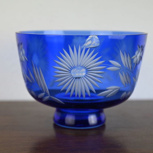 Blue crystal bowl used with cut glass sunflower and leaf design