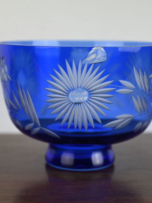 Blue crystal bowl used with cut glass sunflower and leaf design