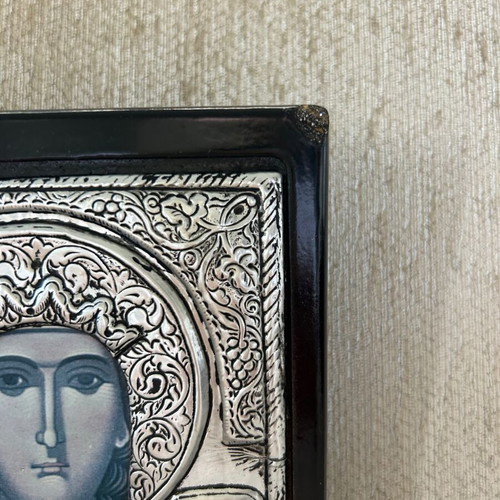 Religious icon used with metal overlay on wooden base