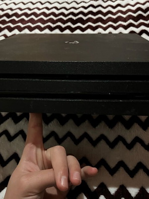 PlayStation 4 Pro 1.5TB used with two controllers