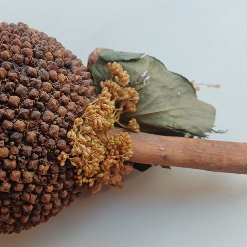 Decorative cinnamon wood and cloves ornament used
