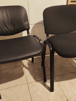 Set of 2 visitor chairs, one leather and one fabric