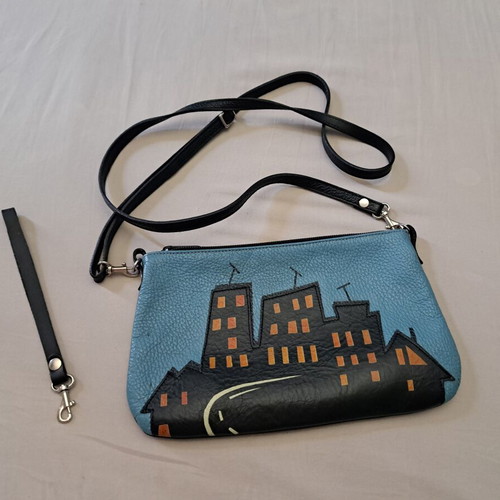 Handmade leather crossbody bag with urban design