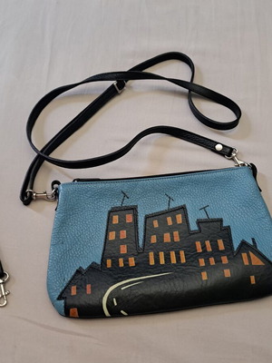 Handmade leather crossbody bag with urban design