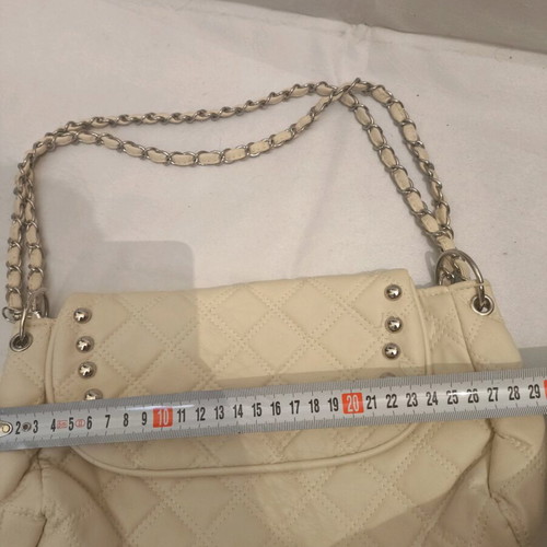 Women's shoulder bag like new, milky color with silver details