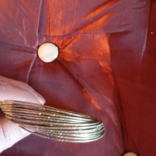 Bracelet made of 32 thin metal pieces like new, gold tone