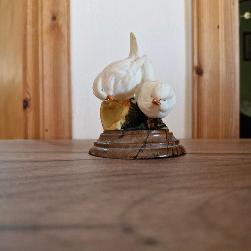 Figurine with doves on wooden base used