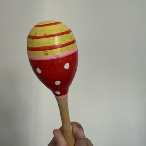 Wooden children's musical instrument used with paint wear