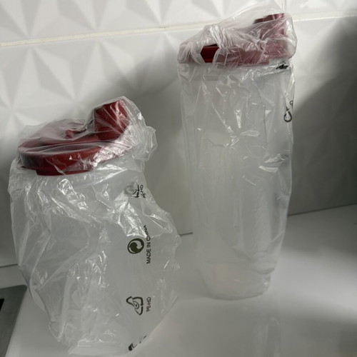Tupperware set with 650ml and 890ml oil pourers and 6 forks new
