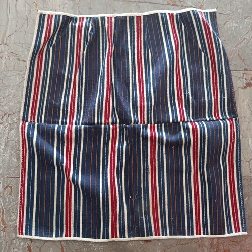 Traditional apron with vertical stripes used