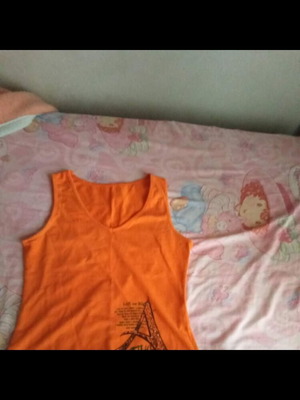 Orange sleeveless blouse used with print