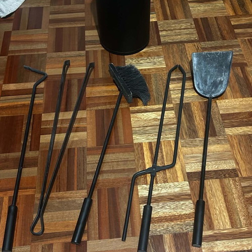 Fireplace screen trifolding with tool set used