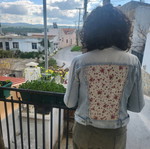 Denim jacket refurbished with upcycled design