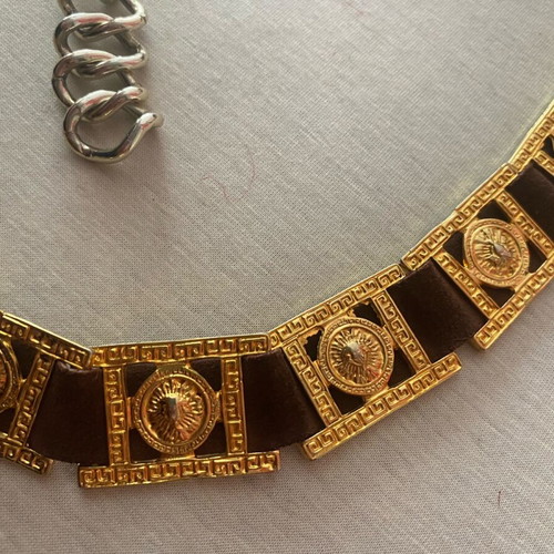 Belt with golden metal details on brown leather, like new