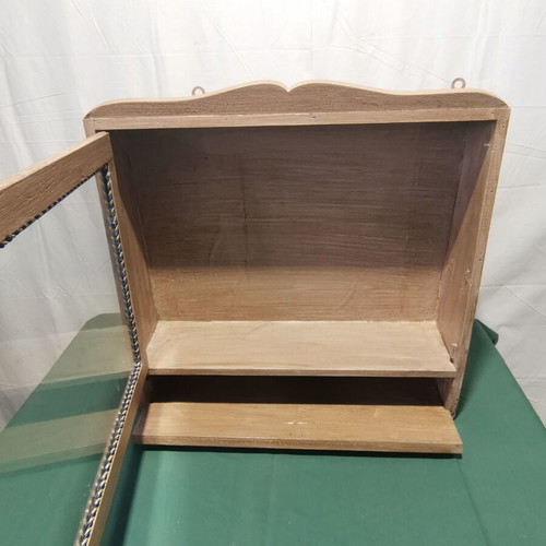 Hanging display cabinet used with glass and storage space, 1960