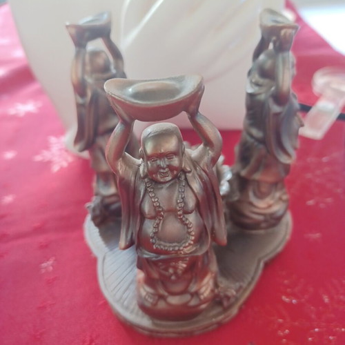 Asian candlestick with 3 smiling figures used, bronze finish