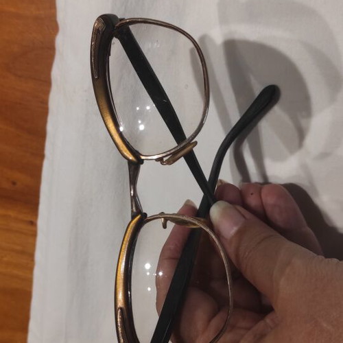 Vintage eyeglasses used, gold color with old case