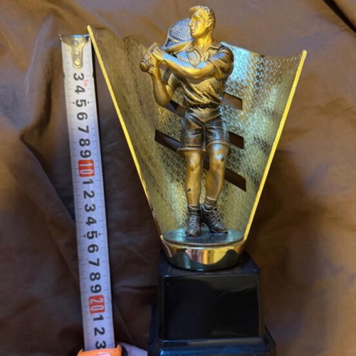 Award trophy used with tennis player figure for padel tournaments
