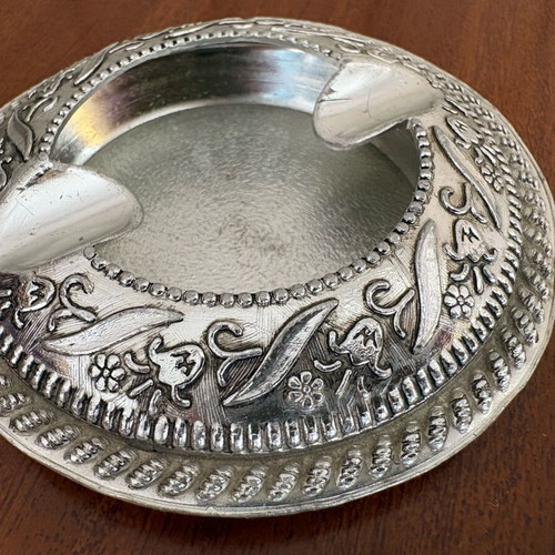 Vintage metal ashtray used with floral embossed details, 1970s