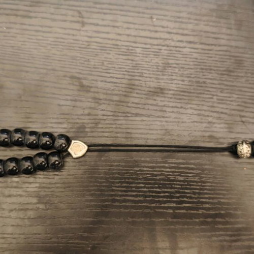 Black worry beads used with metal details