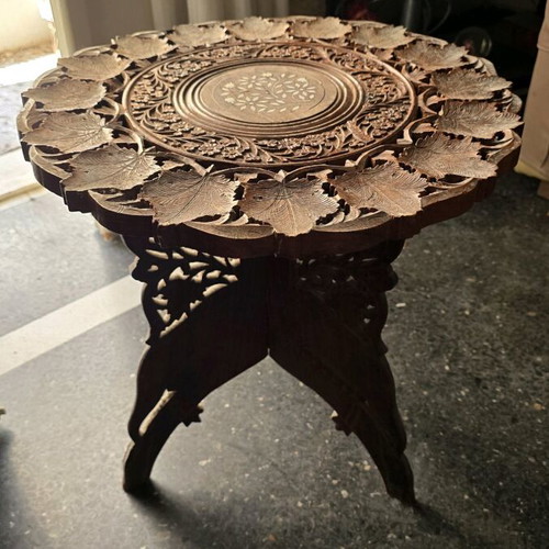Carved coffee table used, 45cm height and 45cm diameter