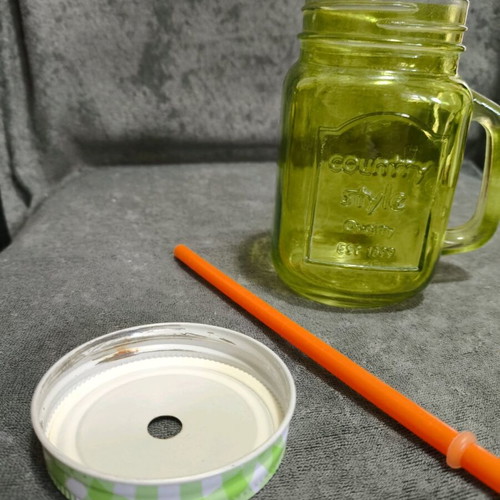 Glass cup with straw used, straw needs replacement
