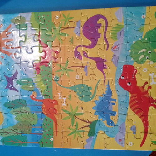 Dinosaur puzzles like new, 75 and 100 pieces