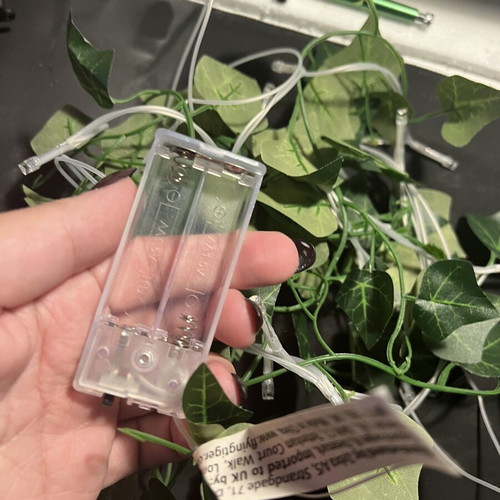 LED string lights with artificial leaves