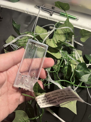 LED string lights with artificial leaves
