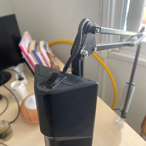 Black screw-on desk lamp used, industrial design